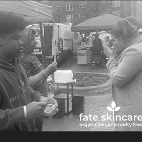 Kimo does a product demonstration for Fate Skincare.