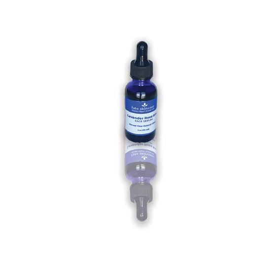 Lavender Rose Bliss Face Serum by Fate Skincare in a cobalt blue 1 oz dropper bottle, formulated to hydrate, smooth, and enhance skin radiance.