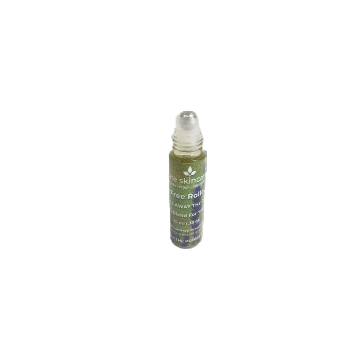 Close-up of open Fate Skincare Pain-Free Roller Ball applicator with herbal blend inside.