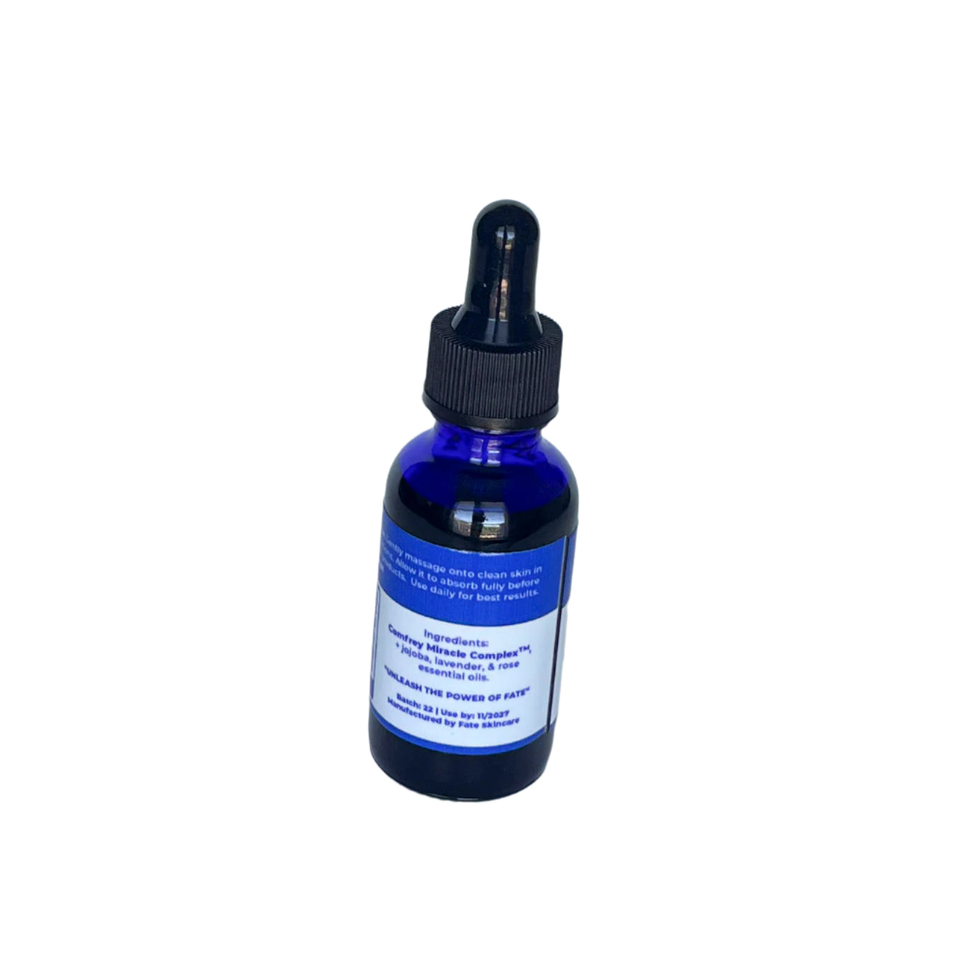 Rear view of the Lavender Rose Bliss Face Serum bottle, displaying the full ingredient list including Comfrey Miracle Complex™, jojoba oil, lavender, and rose essential oils, along with batch information.