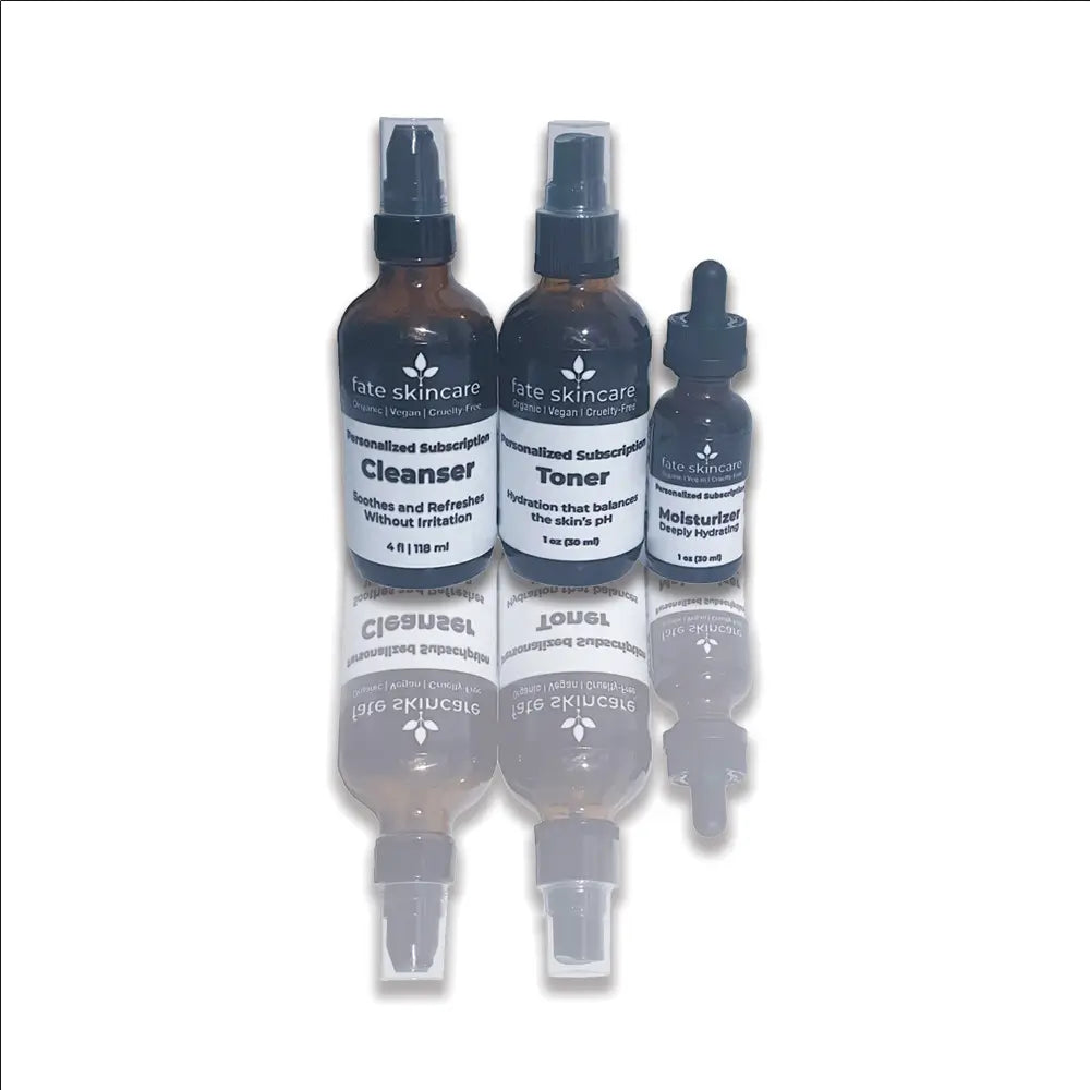 Fate Skincare’s Custom Ritual 3-step facial system featuring a cleanser, toner, and moisturizer in amber glass bottles, designed as a personalized skincare subscription set.