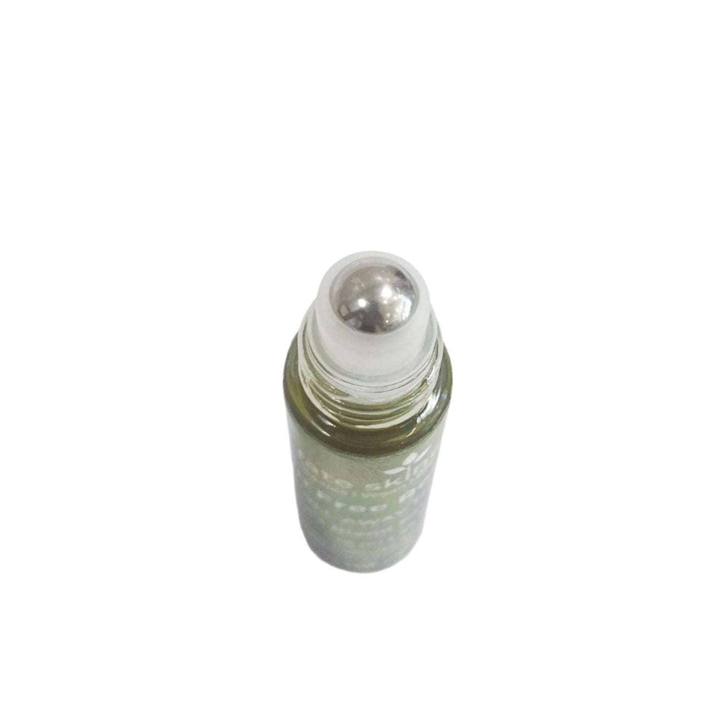 Top-down view of Fate Skincare’s Pain-Free Roller Ball showcasing the stainless-steel applicator and herbal oil blend for targeted relief.