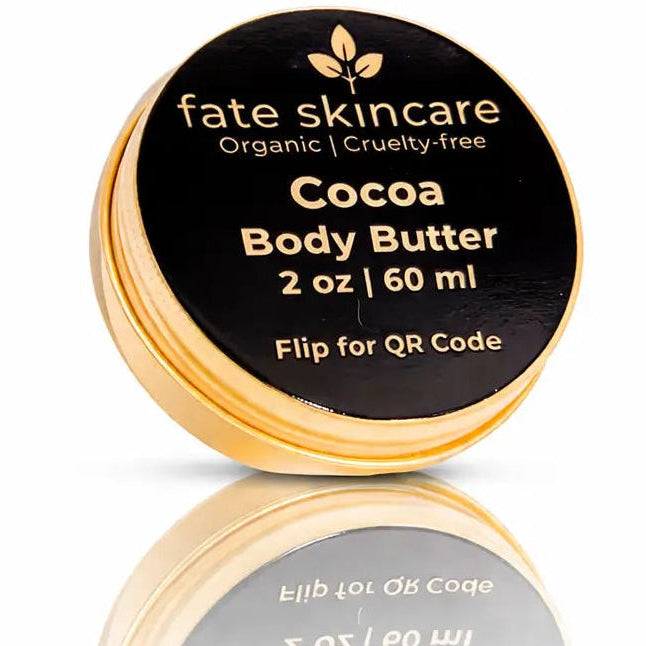 Fate Skincare Cocoa Body Butter in a gold 2 oz tin, organic and cruelty-free moisturizer designed to deeply hydrate and soften dry, sensitive skin