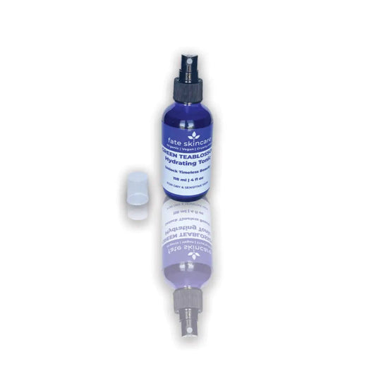 Green Tea Blossom Hydrating Toner by Fate Skincare in a cobalt blue 4 oz spray bottle, crafted to refresh, soothe, and hydrate dry or sensitive skin.