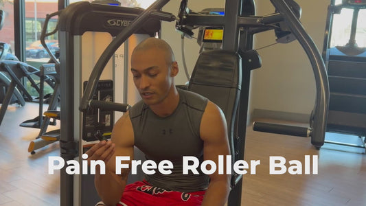 Man applying Fate Skincare Pain-Free Roller Ball™ to lower back before exercise, demonstrating mobility and preparation before pain through core and flexibility movements.